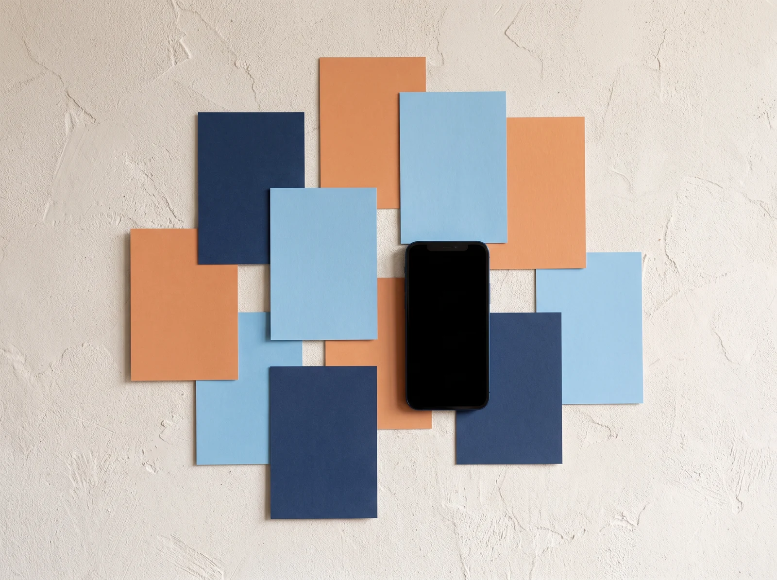 Colour blocks and a phone on a wall